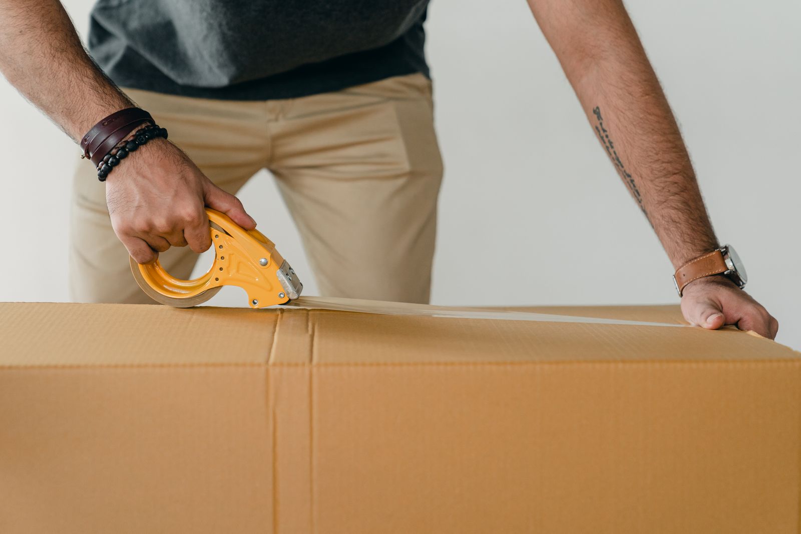 Parcel being sealed with packing tape