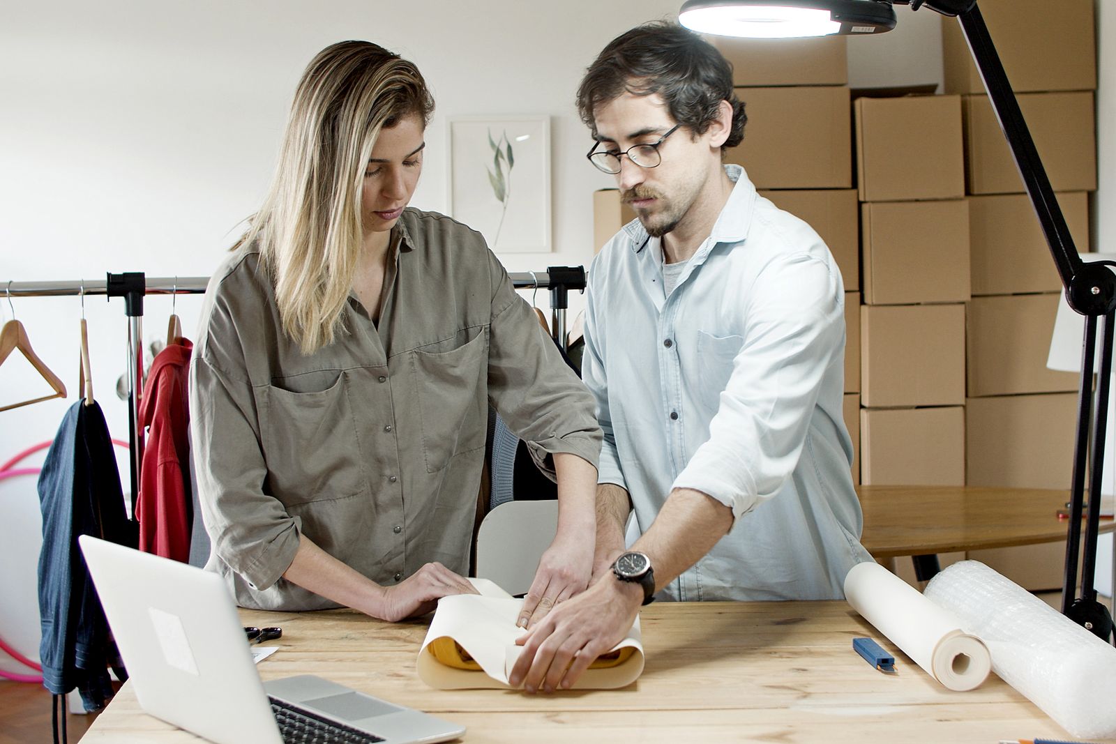 Team packing orders together in a studio