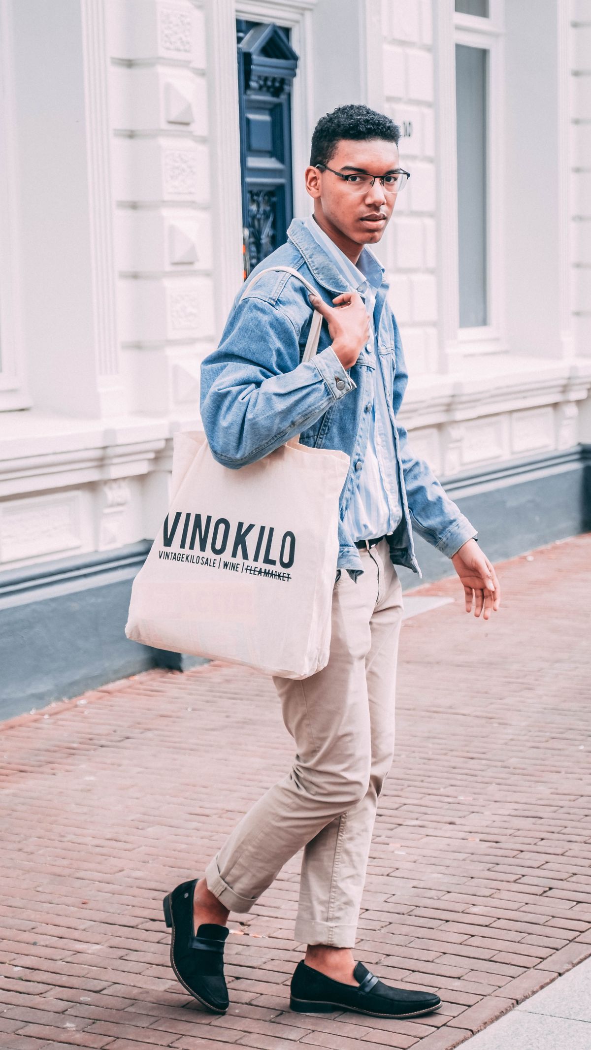Man carrying a printed canvas tote bag